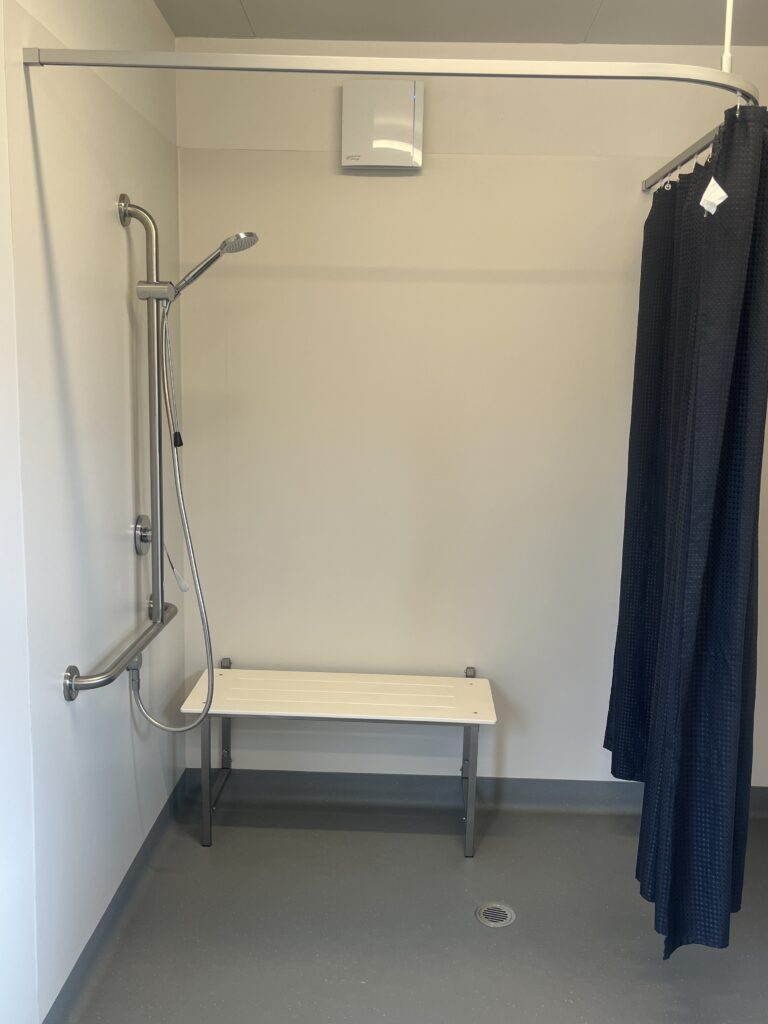 Accessible Shower with seat, grab rails and curtain