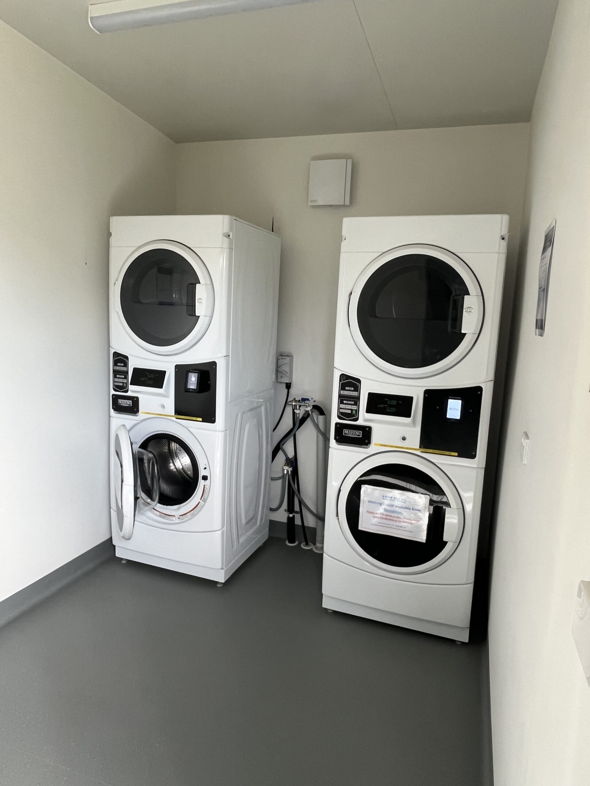 Laundry with stacked washing machines, two low and two high